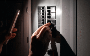 Electrician troubleshooting lights that dim when the air conditioner turns on